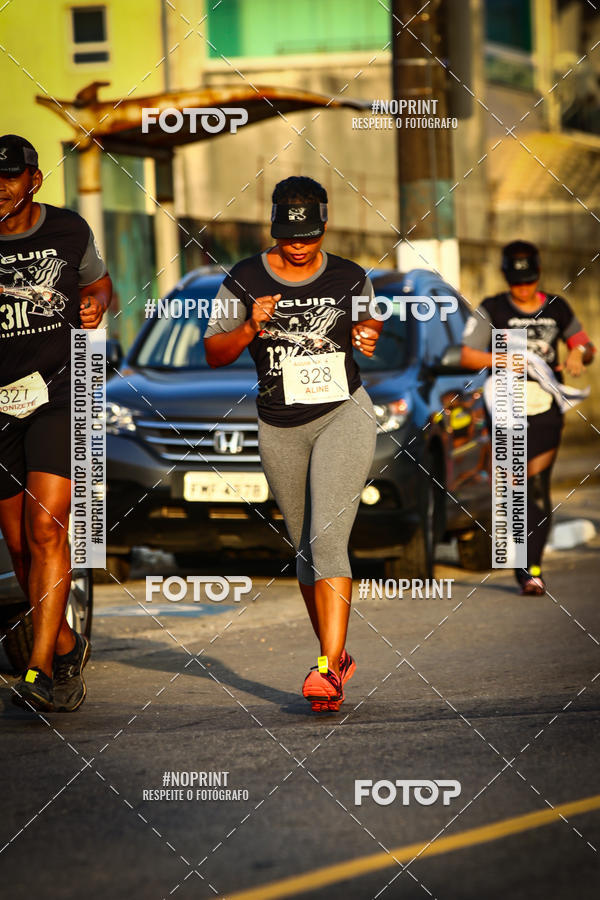 Buy your photos of the eventguia 13K Praia Grande on Fotop
