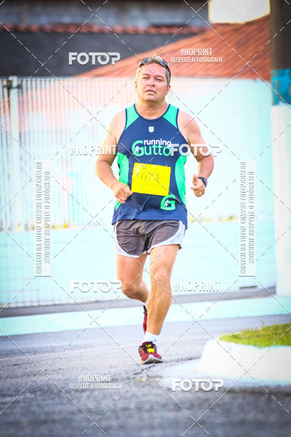 Buy your photos of the eventguia 13K Praia Grande on Fotop