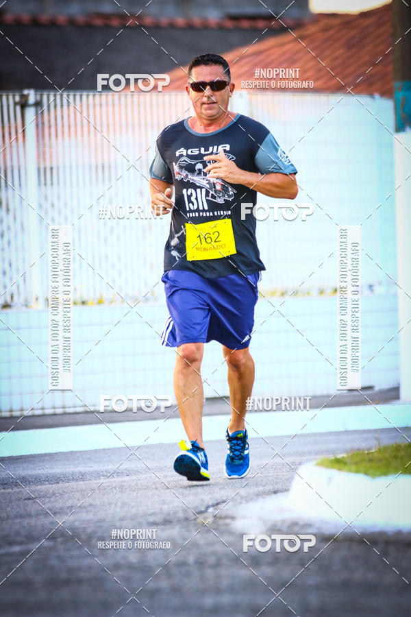 Buy your photos of the eventguia 13K Praia Grande on Fotop