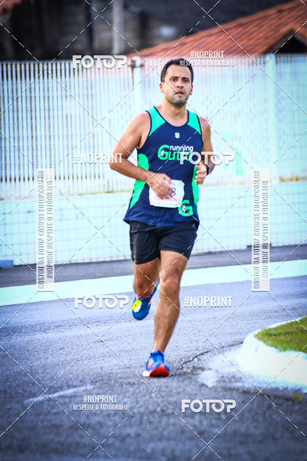Buy your photos of the eventguia 13K Praia Grande on Fotop