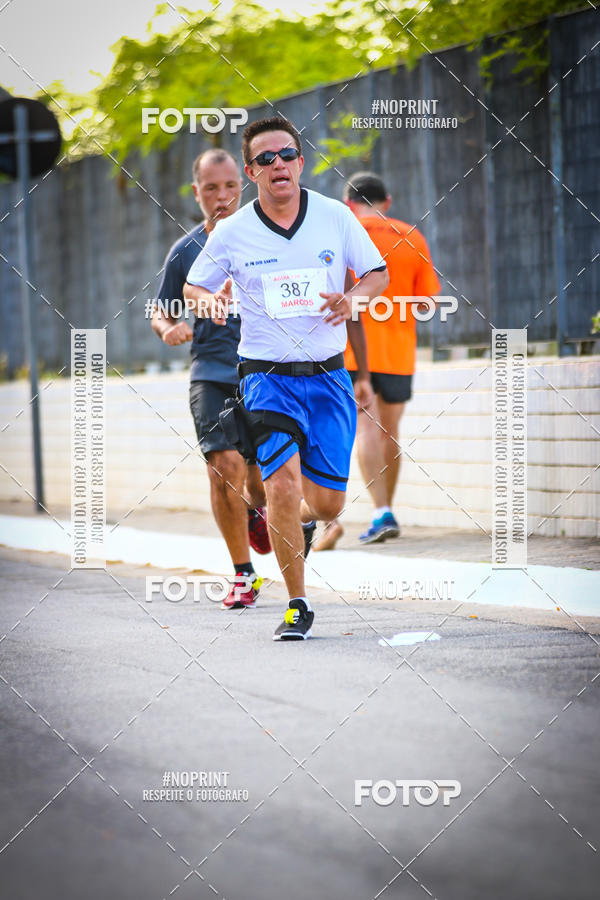 Buy your photos of the eventguia 13K Praia Grande on Fotop