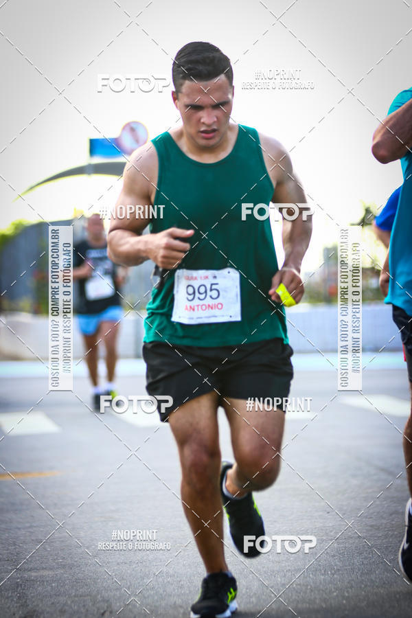 Buy your photos of the eventguia 13K Praia Grande on Fotop