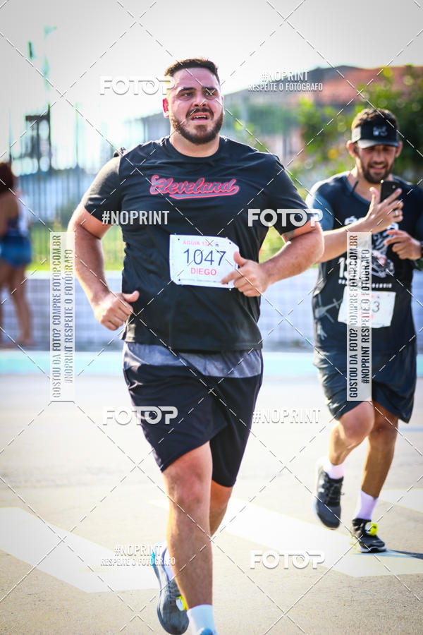 Buy your photos of the eventguia 13K Praia Grande on Fotop