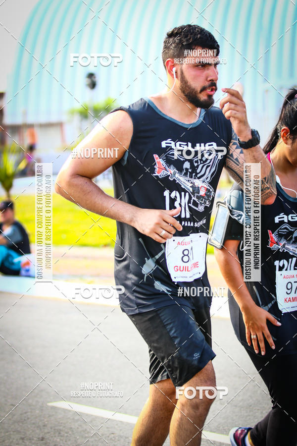Buy your photos of the eventguia 13K Praia Grande on Fotop