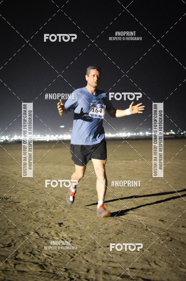 Buy your photos of the eventJovem Pan Night Run Santos on Fotop