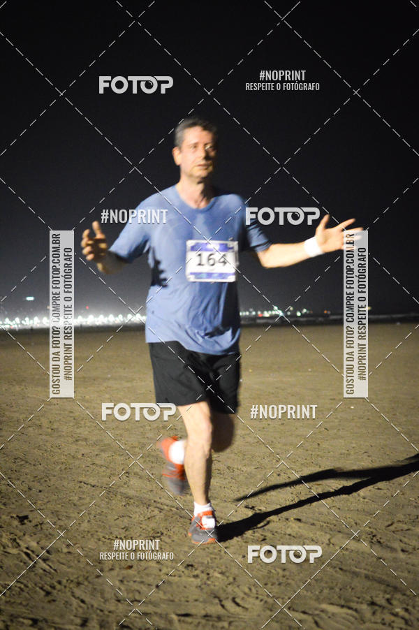 Buy your photos of the eventJovem Pan Night Run Santos on Fotop