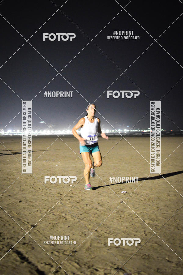 Buy your photos of the eventJovem Pan Night Run Santos on Fotop