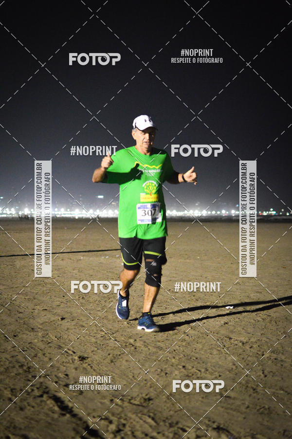 Buy your photos of the eventJovem Pan Night Run Santos on Fotop