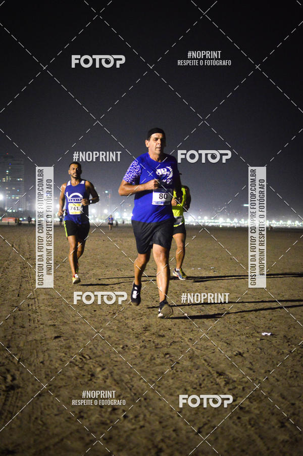 Buy your photos of the eventJovem Pan Night Run Santos on Fotop