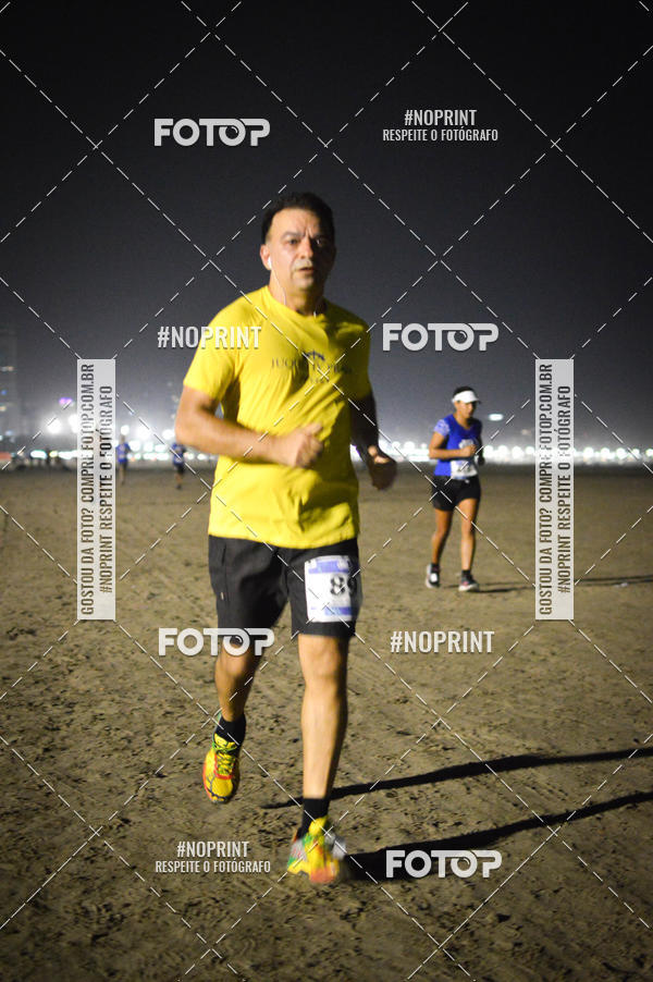 Buy your photos of the eventJovem Pan Night Run Santos on Fotop