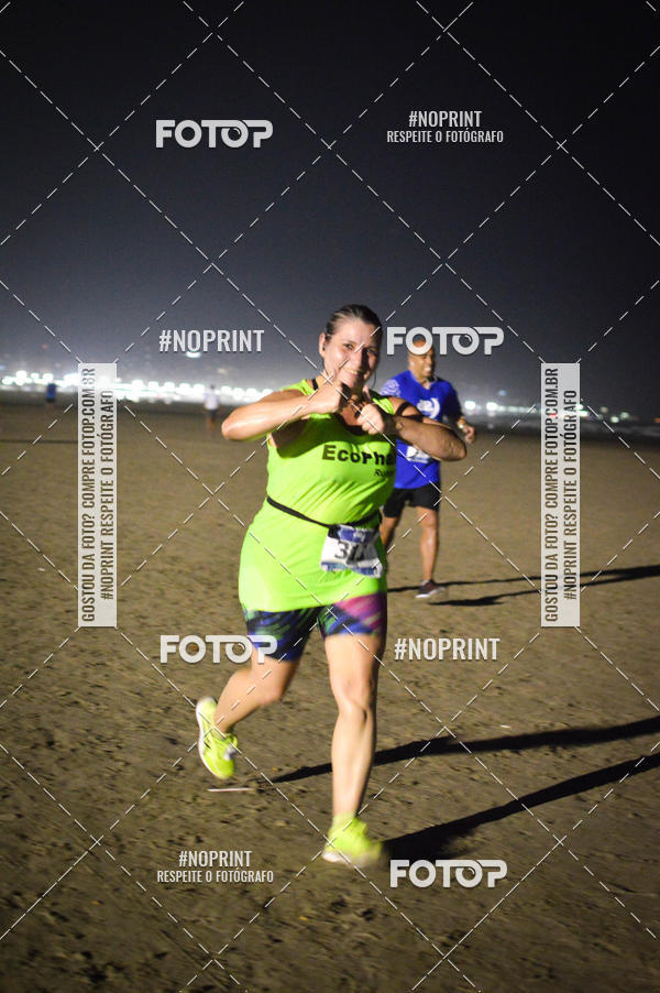 Buy your photos of the eventJovem Pan Night Run Santos on Fotop