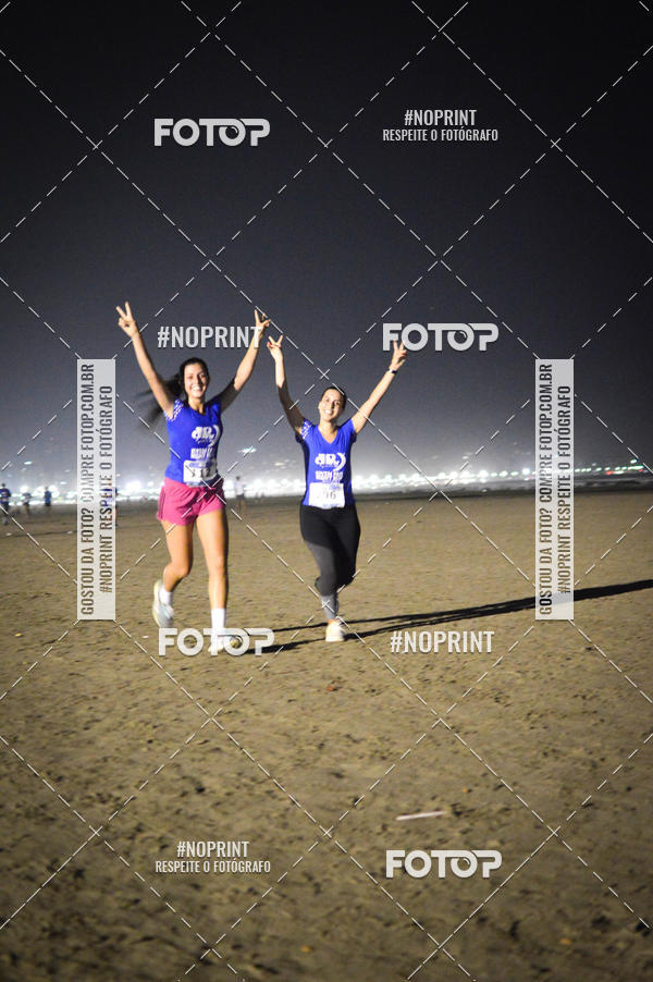 Buy your photos of the eventJovem Pan Night Run Santos on Fotop