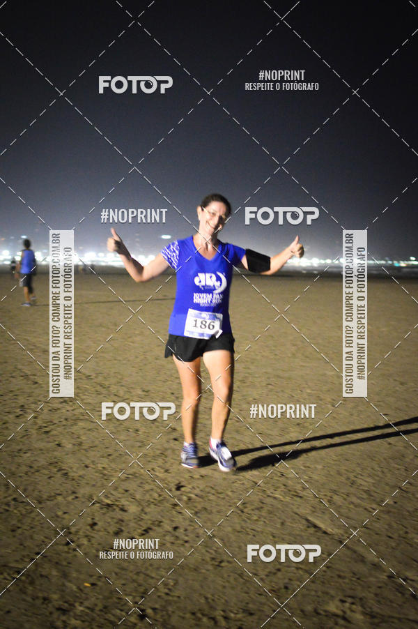 Buy your photos of the eventJovem Pan Night Run Santos on Fotop