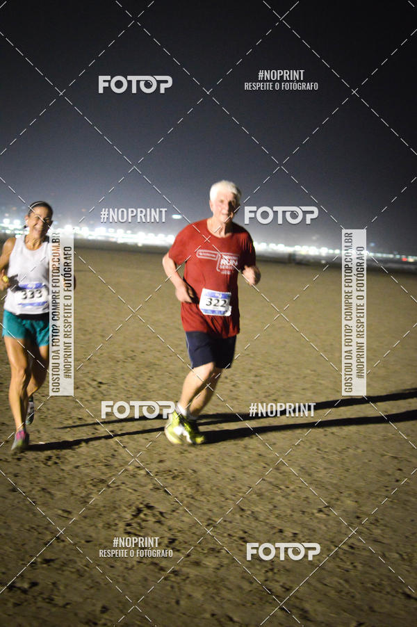 Buy your photos of the eventJovem Pan Night Run Santos on Fotop