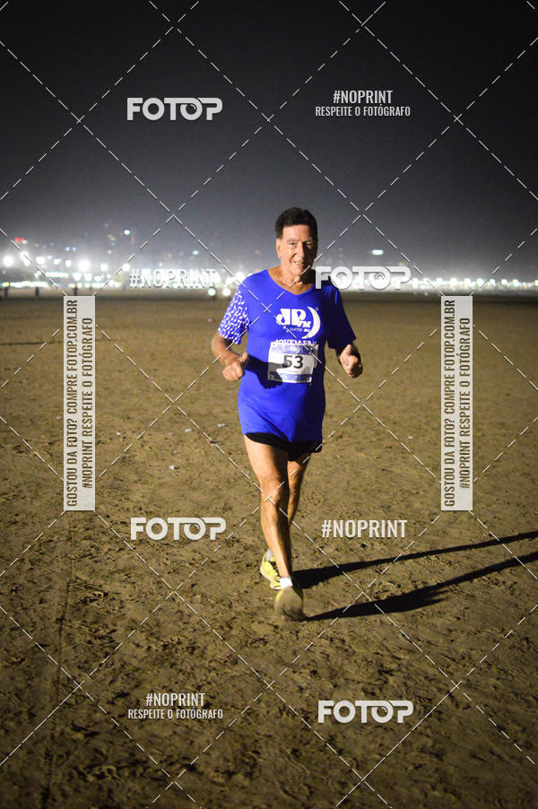 Buy your photos of the eventJovem Pan Night Run Santos on Fotop