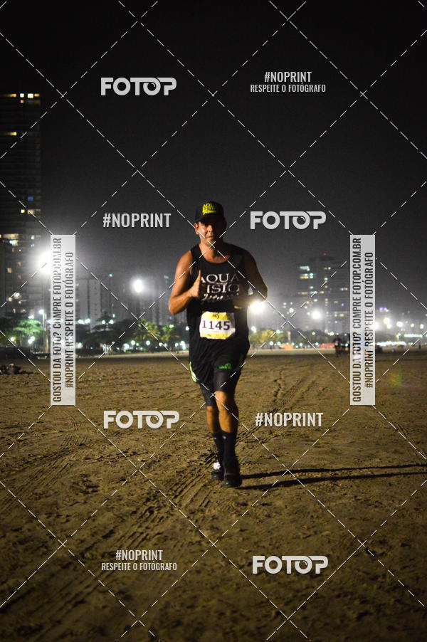 Buy your photos of the eventJovem Pan Night Run Santos on Fotop