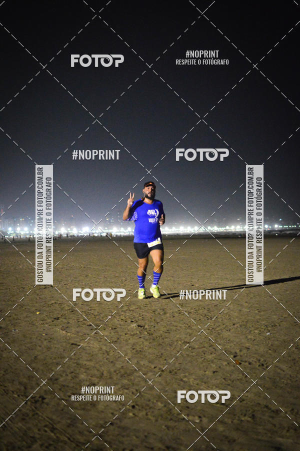 Buy your photos of the eventJovem Pan Night Run Santos on Fotop