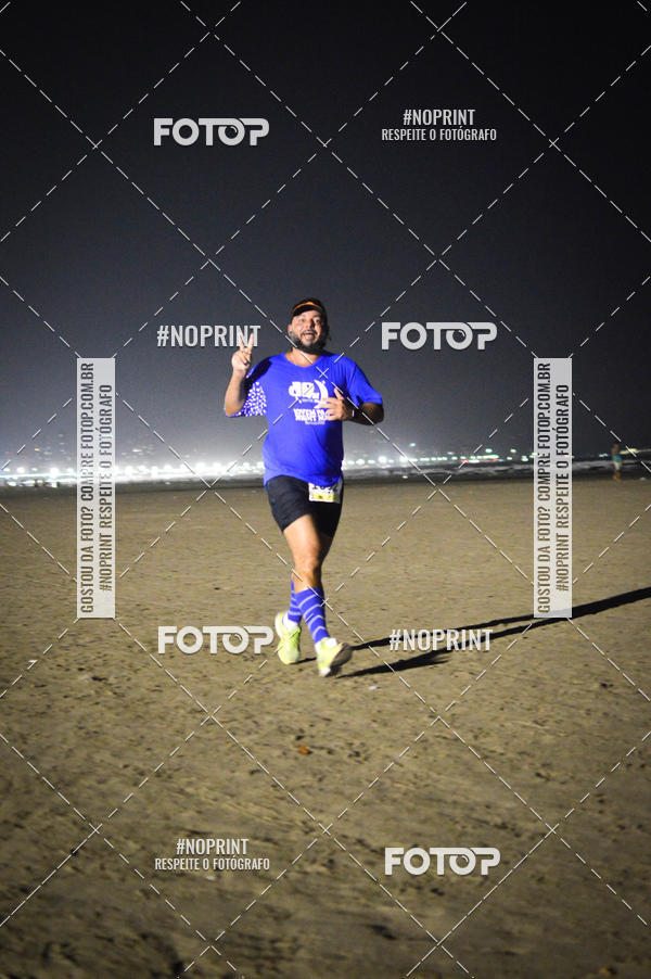 Buy your photos of the eventJovem Pan Night Run Santos on Fotop