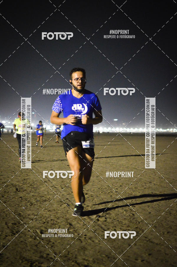 Buy your photos of the eventJovem Pan Night Run Santos on Fotop