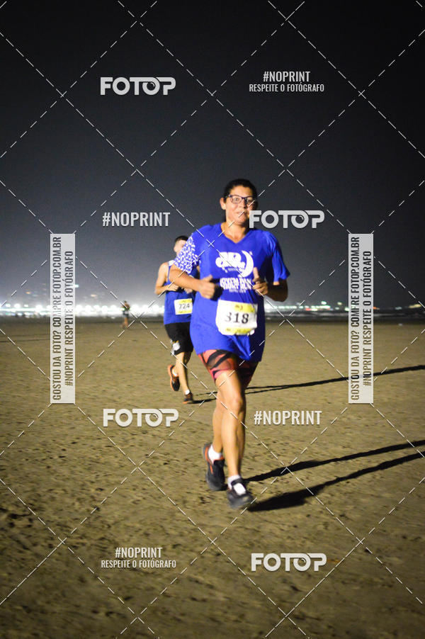 Buy your photos of the eventJovem Pan Night Run Santos on Fotop