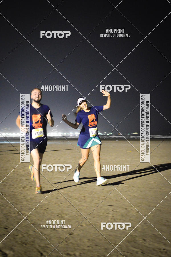 Buy your photos of the eventJovem Pan Night Run Santos on Fotop