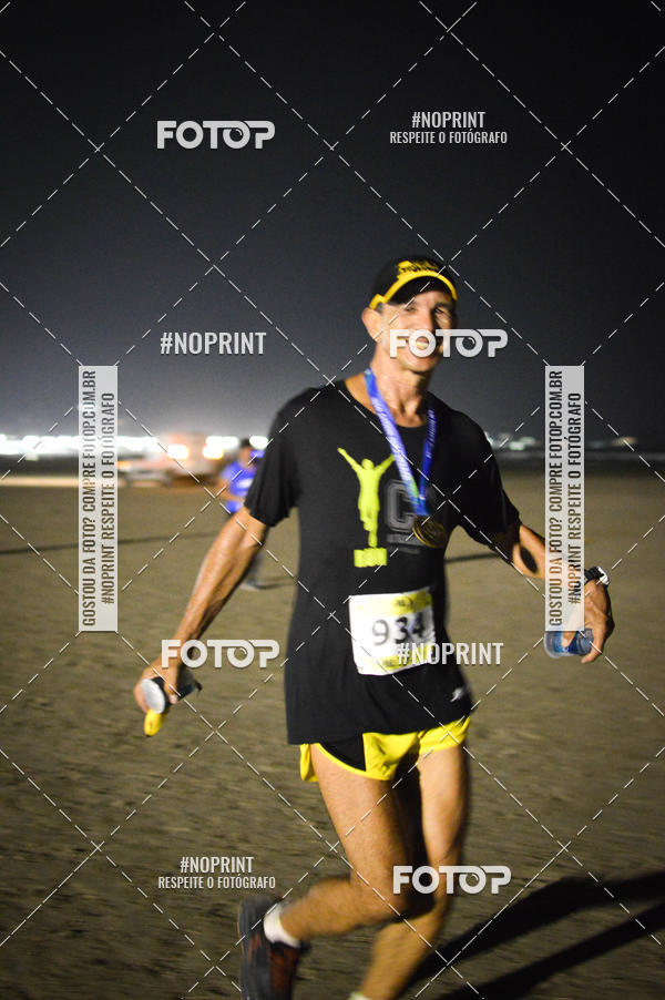 Buy your photos of the eventJovem Pan Night Run Santos on Fotop