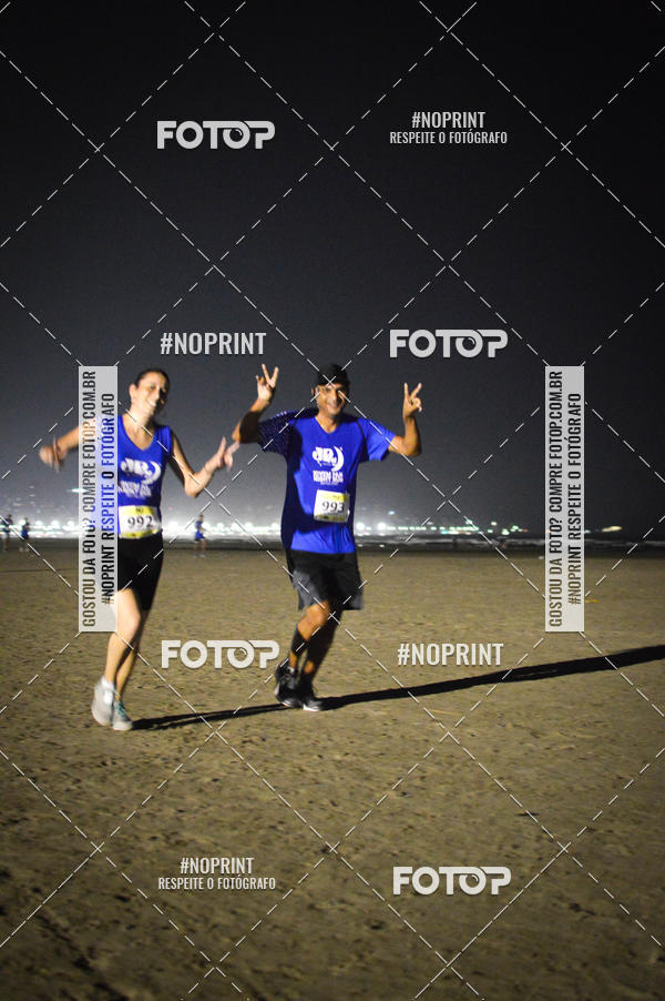 Buy your photos of the eventJovem Pan Night Run Santos on Fotop