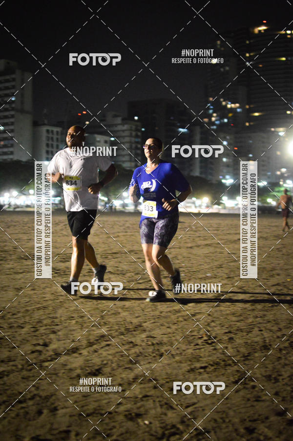 Buy your photos of the eventJovem Pan Night Run Santos on Fotop