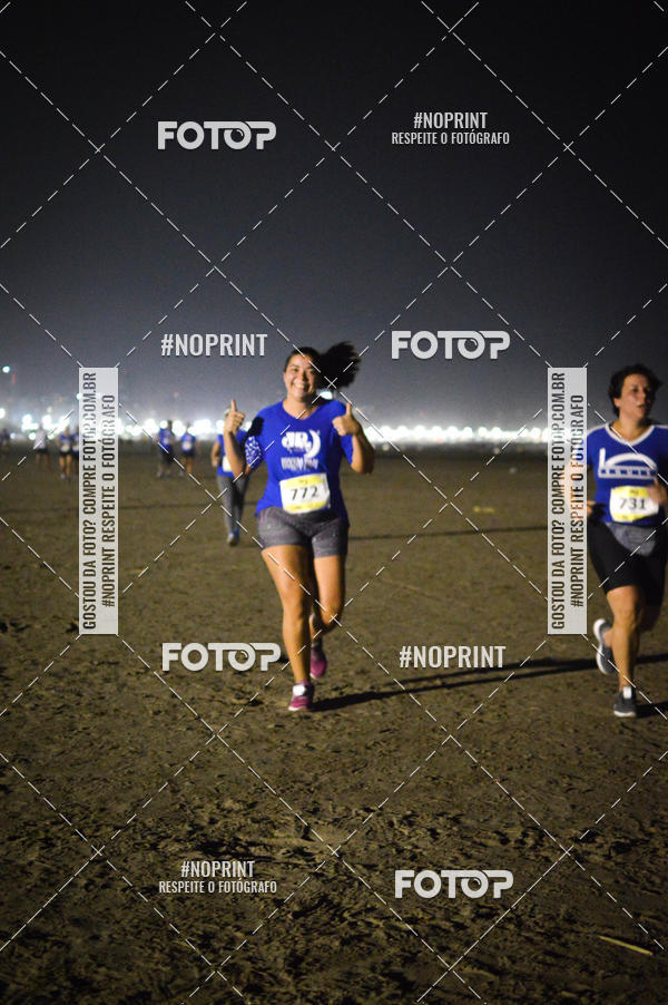Buy your photos of the eventJovem Pan Night Run Santos on Fotop