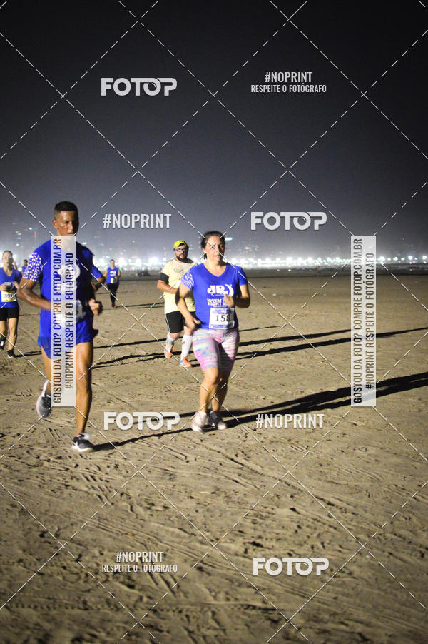 Buy your photos of the eventJovem Pan Night Run Santos on Fotop