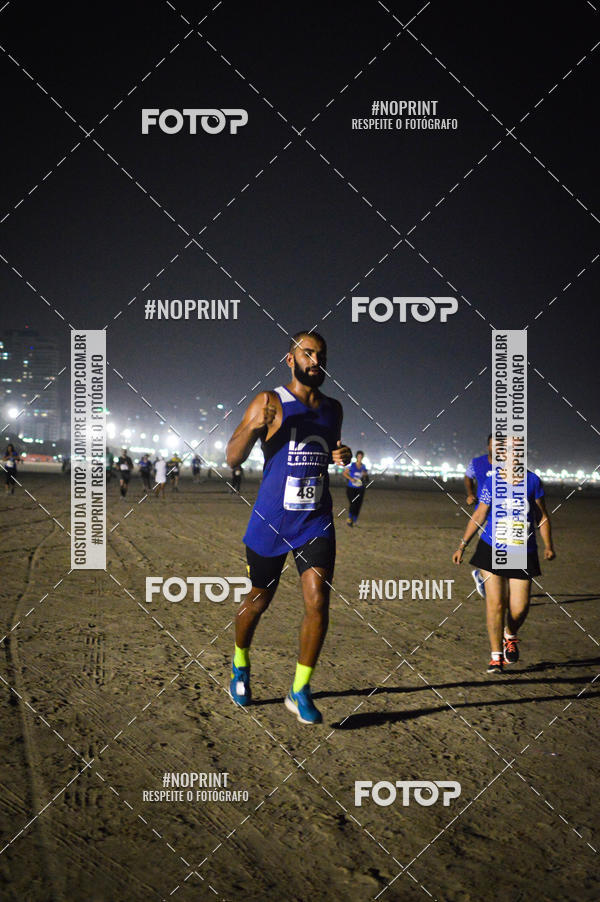Buy your photos of the eventJovem Pan Night Run Santos on Fotop