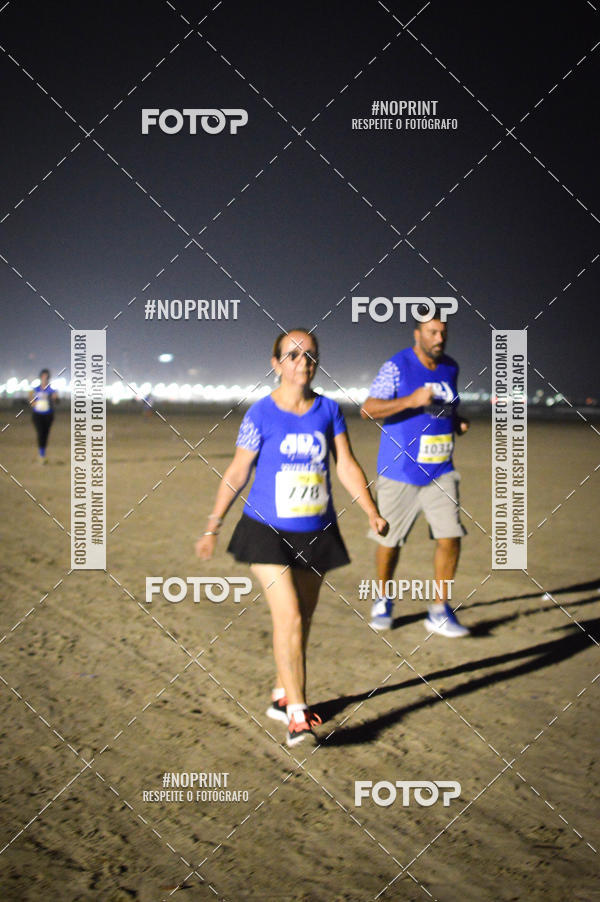 Buy your photos of the eventJovem Pan Night Run Santos on Fotop
