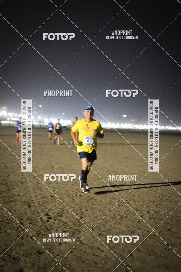 Buy your photos of the eventJovem Pan Night Run Santos on Fotop