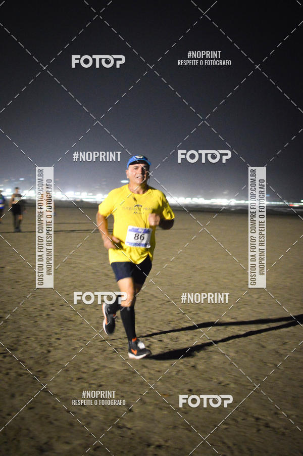 Buy your photos of the eventJovem Pan Night Run Santos on Fotop