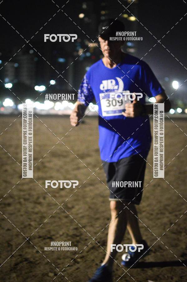 Buy your photos of the eventJovem Pan Night Run Santos on Fotop