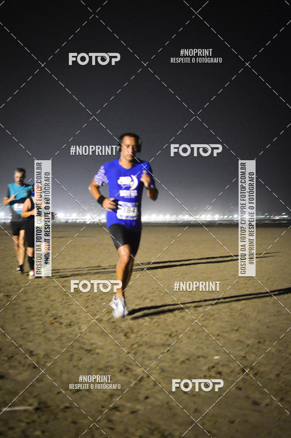 Buy your photos of the eventJovem Pan Night Run Santos on Fotop