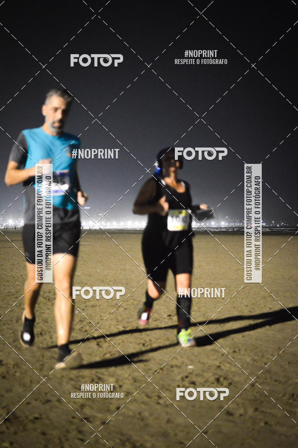 Buy your photos of the eventJovem Pan Night Run Santos on Fotop