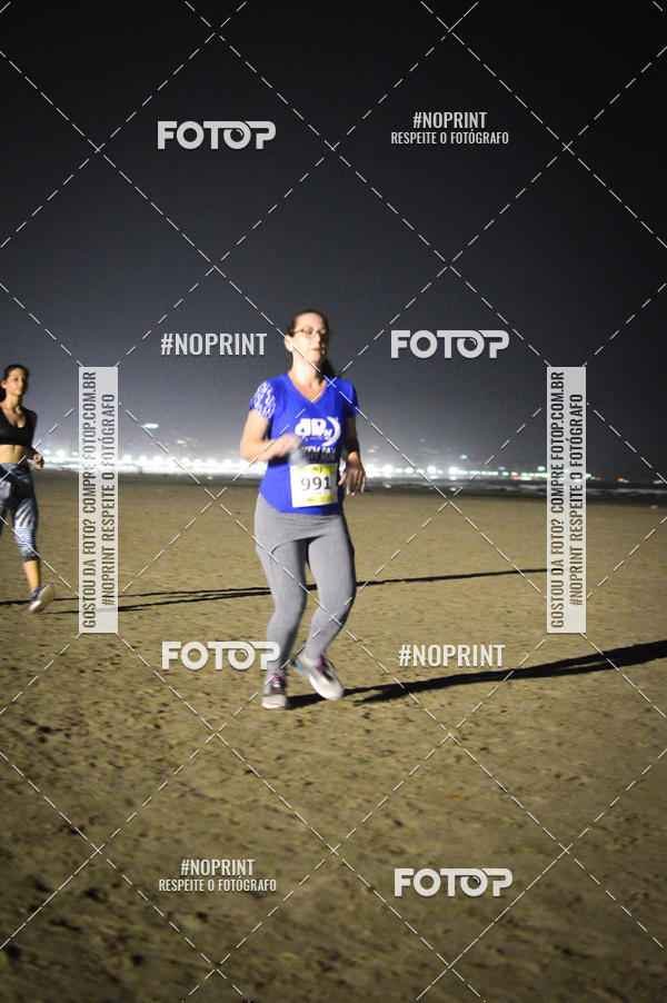 Buy your photos of the eventJovem Pan Night Run Santos on Fotop