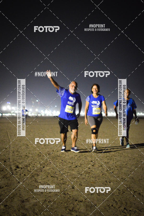 Buy your photos of the eventJovem Pan Night Run Santos on Fotop
