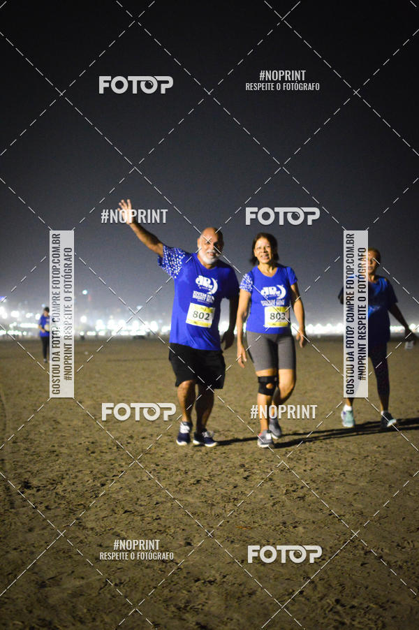 Buy your photos of the eventJovem Pan Night Run Santos on Fotop