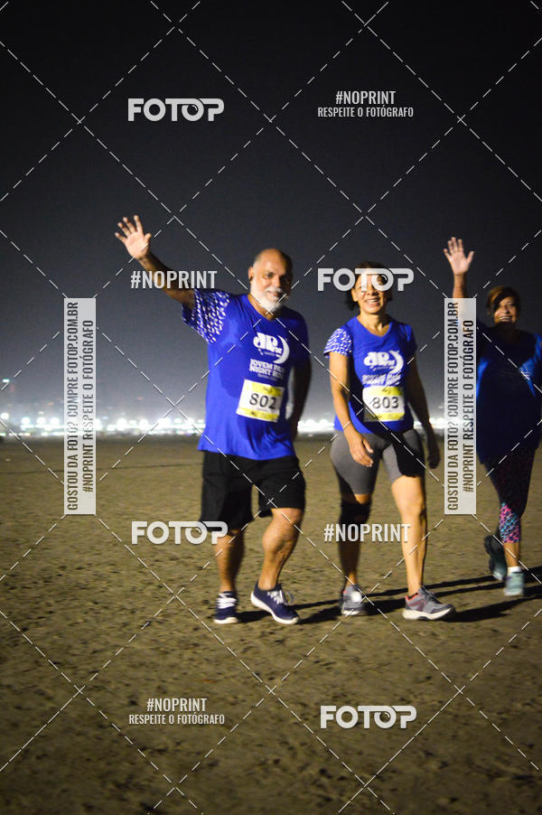 Buy your photos of the eventJovem Pan Night Run Santos on Fotop