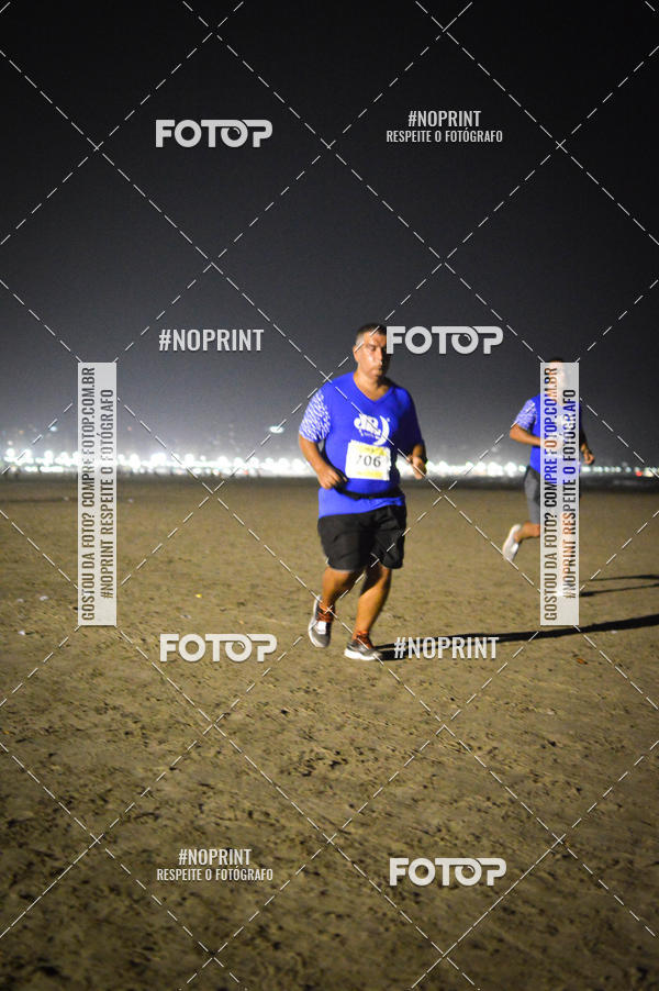Buy your photos of the eventJovem Pan Night Run Santos on Fotop