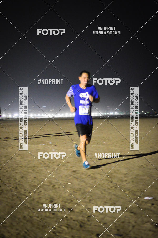 Buy your photos of the eventJovem Pan Night Run Santos on Fotop