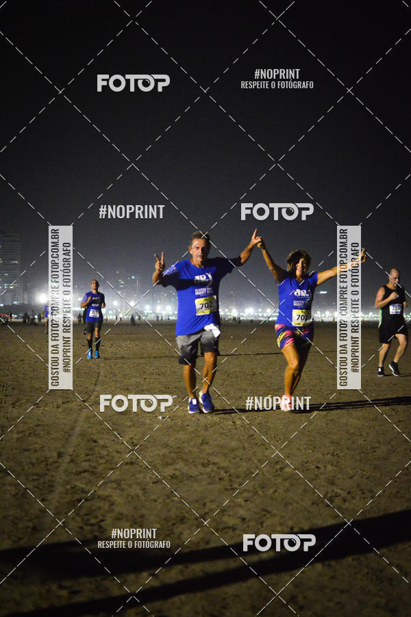 Buy your photos of the eventJovem Pan Night Run Santos on Fotop