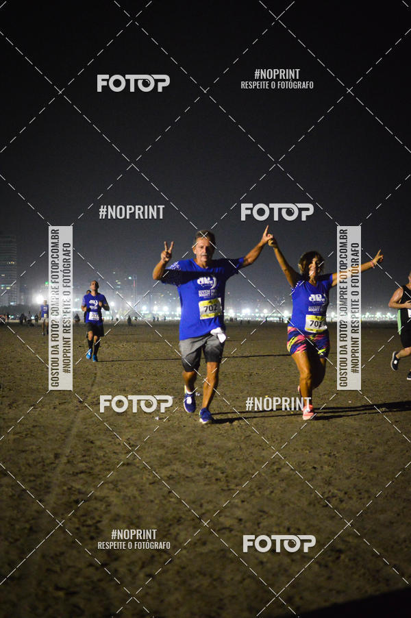 Buy your photos of the eventJovem Pan Night Run Santos on Fotop
