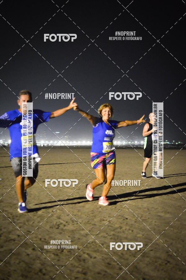 Buy your photos of the eventJovem Pan Night Run Santos on Fotop