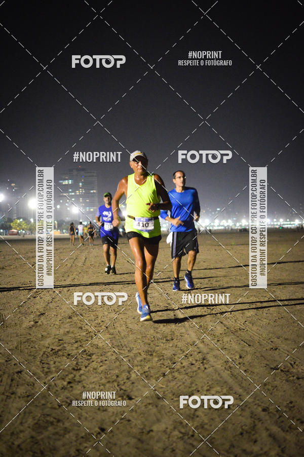 Buy your photos of the eventJovem Pan Night Run Santos on Fotop