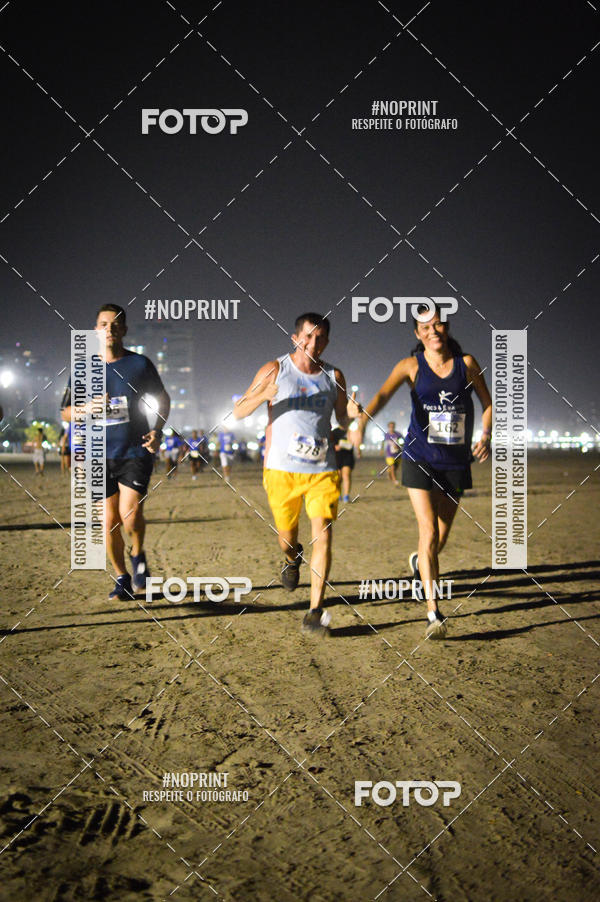 Buy your photos of the eventJovem Pan Night Run Santos on Fotop
