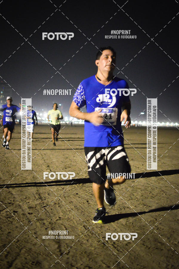 Buy your photos of the eventJovem Pan Night Run Santos on Fotop