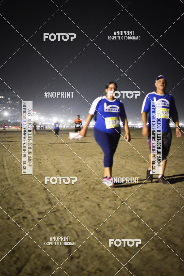 Buy your photos of the eventJovem Pan Night Run Santos on Fotop